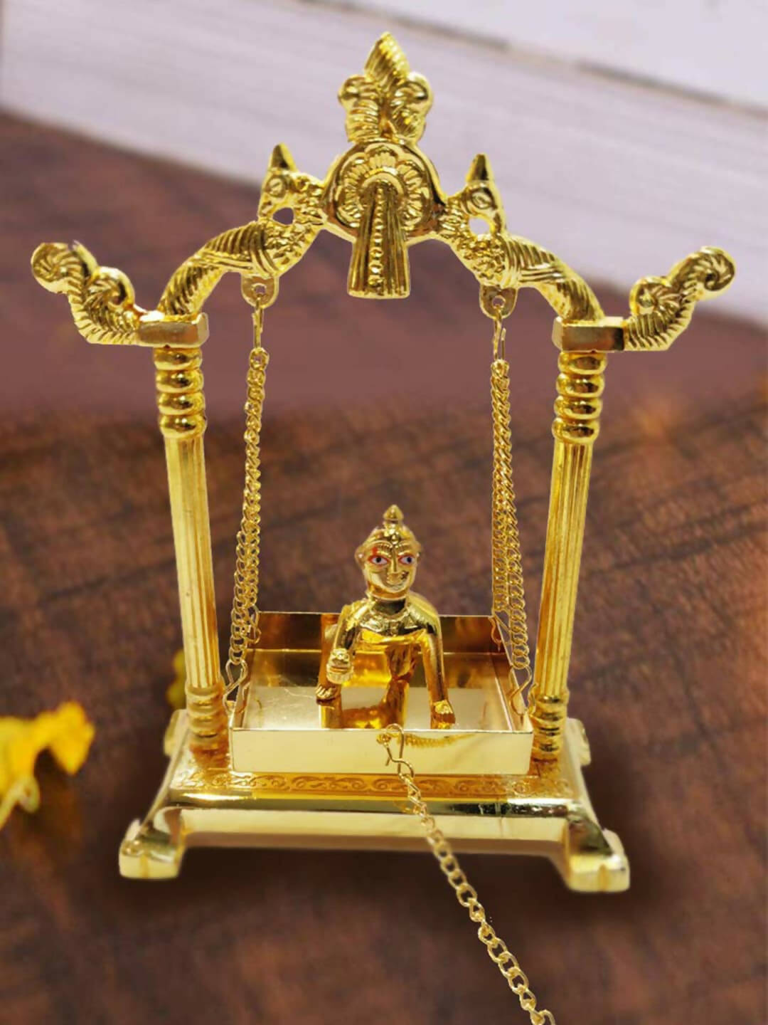 CraftVatika Gold Toned Aluminium Swing Jhula With Ladoo Gopal